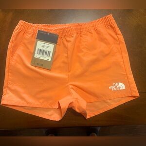 Girls small NorthFace shorts. Orange/coral colored. New with tags.